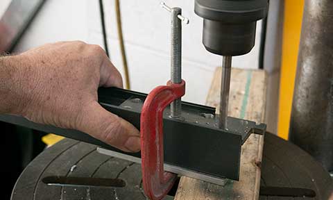 showing the fitting of the jig into the end of a length of No-weld framing extrusion