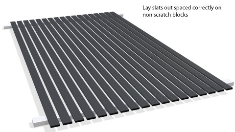 Slats lying on two lengths of non-scratching material